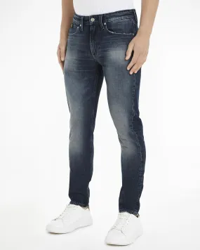 Jeans slim tapered-fit in cotone stretch lavaggio scuro stone washed con baffature