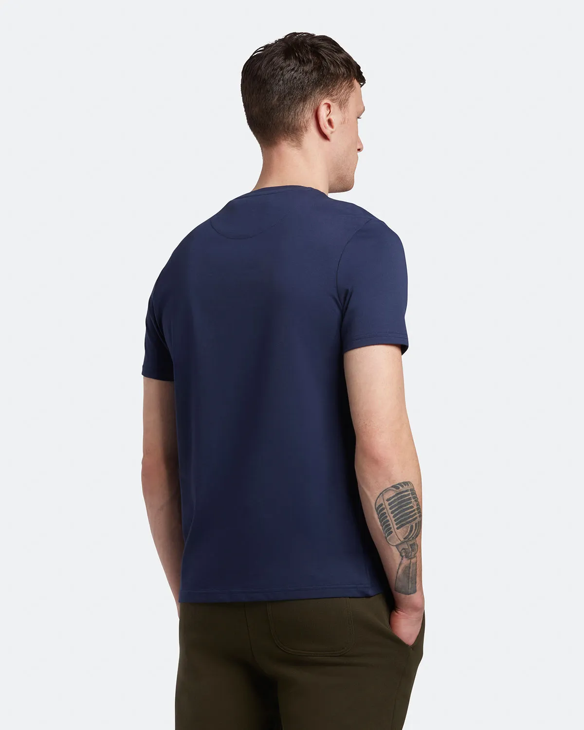 T-shirt mezza manica blu in cotone con logo aquila gialla ricamata sul petto